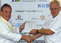 Eric Carter (right) presents Mike Collins with the SAIMC certificate after the presentation.